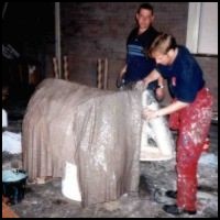 Plastering the baby elephant.